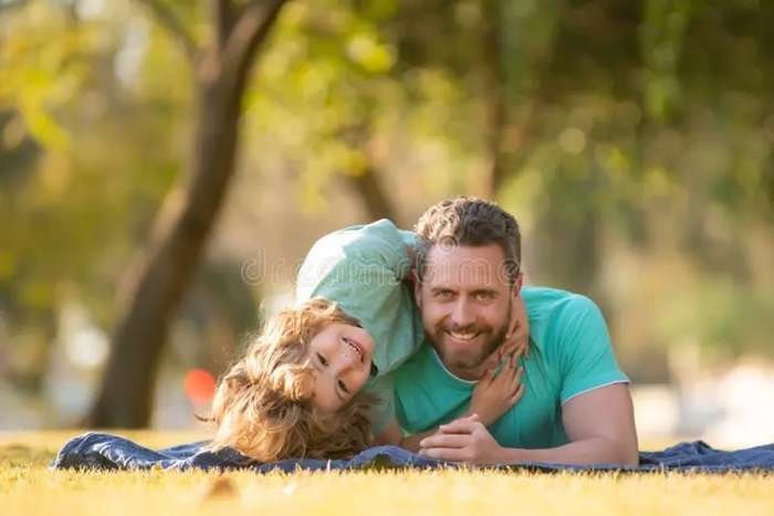 childhood parenthood kids concept happy father son playing together outdoor children love parents affection tenderness lovely 215195661